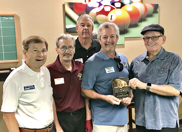 Willie “The Wizzard” Foster, Iron Oaks Breakers Pool League’s Travel Team Coordinator from Sun Lakes (far right), handing over the Bronze Plaque to Dominic “The Doctor” Borland PPB Travel Team Captain, while Larry “CueStick” Stadler, president of The Iron Oaks Breakers Pool League (far left), and Joe “Fast Eddie” Giammarino, president of the PPB (second from left), and Gary “One Rail” Barlow, PPB Travel team co-captain, (center) look on.