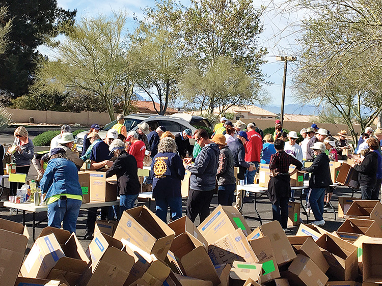Each year, SBCO Food Drive volunteers sort, box, and deliver thousands of pounds of donations to Tri-Community Food Bank.