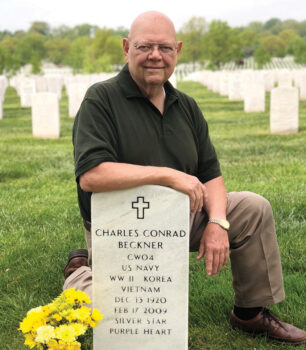 John Floyd at Charles Beckner’s gravesite in Arlington National Cemetery