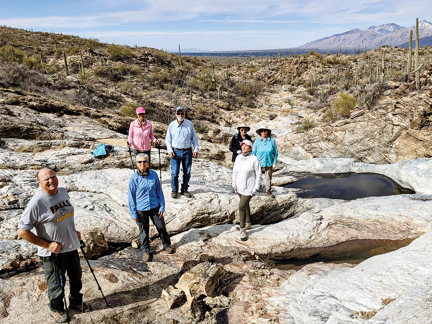 Hikers pause by Little Horse Tank pools. (Photo by Ruth Caldwell)