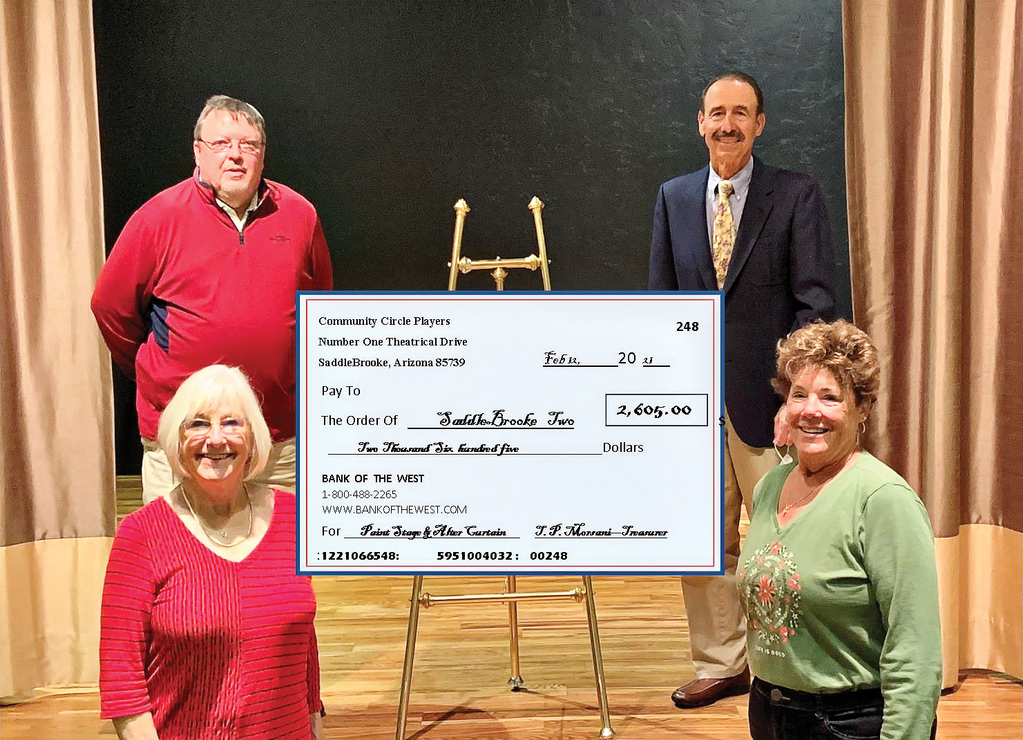 SaddleBrooke TWO Executive Director Damon Williams accepting a check from CCP’s CFO Tim Morsani and CCP co-founders Shawne Cryderman and Susan Sterling.