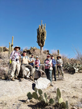 Hikers pose in front of a great saguaro (Photo by Tim Butler)