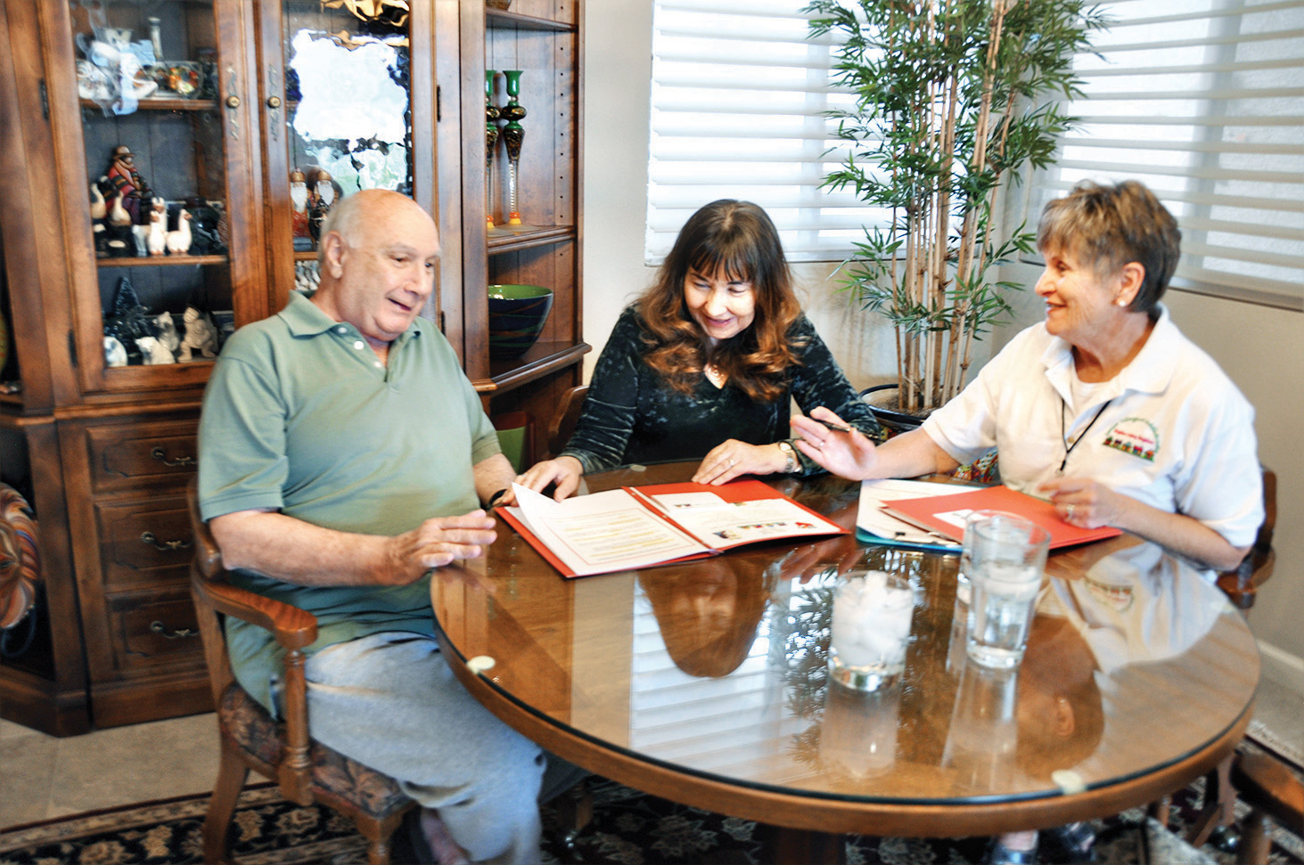 Vicki and Nick Palumbo meet with membership volunteer, LaVonne Ashwood, to join Senior Village.