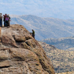 Adventure Club members rapel off a cliff face on Mount Lemmon