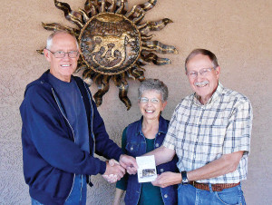 Chuck and Shirley Kaltenbach won the recent SaddleBrooke Hiking Club Geocache Competition and were presented with a Summit Hut gift certificate by GPS Workshop organizer Roy Carter; photo by Karen Carter.