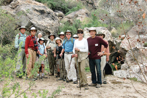 An early March hike to Dripping Springs in Catalina State Park provided hikers with views of several holes where Hohokam Indians used to grind grains, a crested saguaro, numerous wildflowers and a tranquil canyon stream. Left to right: Roger Hove, Neil Christenson, Hyman Beraznik, Barbara Rosenthal, Frank Hartley, Roseanne Beraznik, Bob Giesen, Jack Rosenthal, Catherine Giesen, Gail and Mike Wagner and Bob Keasling; photo by hiking guide Litch Litchfield.