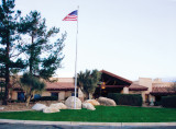 The monument will be located behind the rocks to the right of the flag and centered on the portico of the clubhouse. Some of the rocks will be relocated.