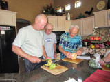 Jack Grech and Duane Waldo help Al Rhodes with tortilla soup preparation