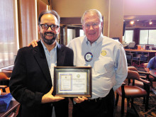 Rotarian Neil Deppe presents Don Chatfield with a certificate of appreciation.