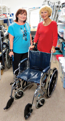 Connie Saiz and Kathleen Weiss ready medical equipment for loan.