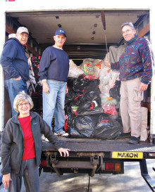 We borrowed the Catalina Community Services truck to deliver presents to San Carlos for the Apache Indian children. From top left: David Wisniewski, Phil Cummings, Sam Carmen and Ellen Perkins