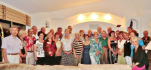 British Club members enjoy wine and cheese at the Taylor home.