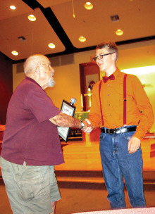 Moose Creighton (L) presenting a certificate of appreciation to the Scoutmaster of BSA Troop 270