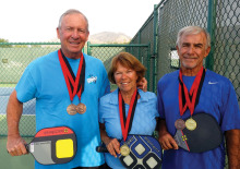 SaddleBrooke resident Bob Shelton (left) and former SaddleBrooke residents, Barbara Gallagher (center) and Larry Gallagher (right), display their medals from the recent pickleball competition at the Huntsman World Senior Games in Utah.