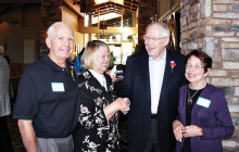 Pat and Barbara Webb are greeted by Pastor Wayne Viereck and his wife Pat as they leave a Sunday service.