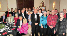 Residents of Unit 32 assemble before the holiday dinner.