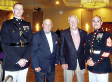 Marines honored at the dinner dance, left to right: Marine Captain Zachary Knight, Military Food Banks Chair Moose Creighton, STS President George Bidwell and Marine First Sergeant Jason Hamm.