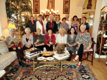 The women of the British Club enjoy a holiday coffee gathering.