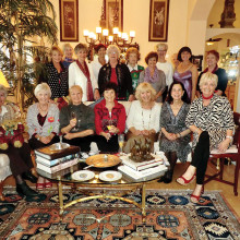 The women of the British Club enjoy a holiday coffee gathering.