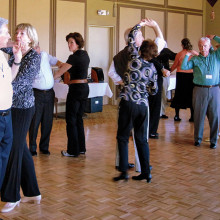 Instructors Jeanny and Wally Mara teaching a Merengue figure