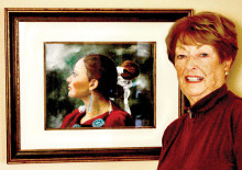 Barbara Cox with her painting, Navajo Princess