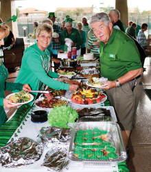 Dining up at the food table are Pat Andrea (left) and John Martin.