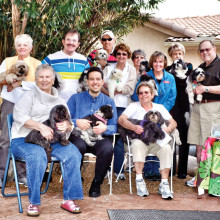 The Shih Tzus brought their owners to hear Dr. Dimitri Brown.