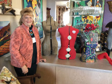 Marianne Lyons with some of her decorated, antique dress forms.