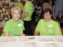 Health Fair volunteers are ready for action in the green tee shirt that is worn proudly by volunteers.