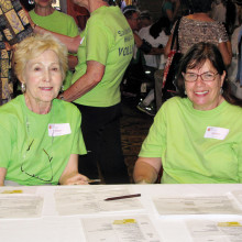 Health Fair volunteers are ready for action in the green tee shirt that is worn proudly by volunteers.