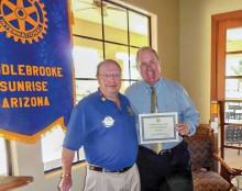 Dick Kroese, President of the SaddleBrooke Sunrise Rotary Club, presenting Bob Logan with a certificate of appreciation at a recent breakfast meeting.