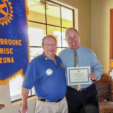 Dick Kroese, President of the SaddleBrooke Sunrise Rotary Club, presenting Bob Logan with a certificate of appreciation at a recent breakfast meeting.