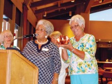 Caroline Rolfe accepts a token of appreciation for her annual contribution of the Invitational’s premiere door prize of a beautifully designed and hand crocheted afghan.