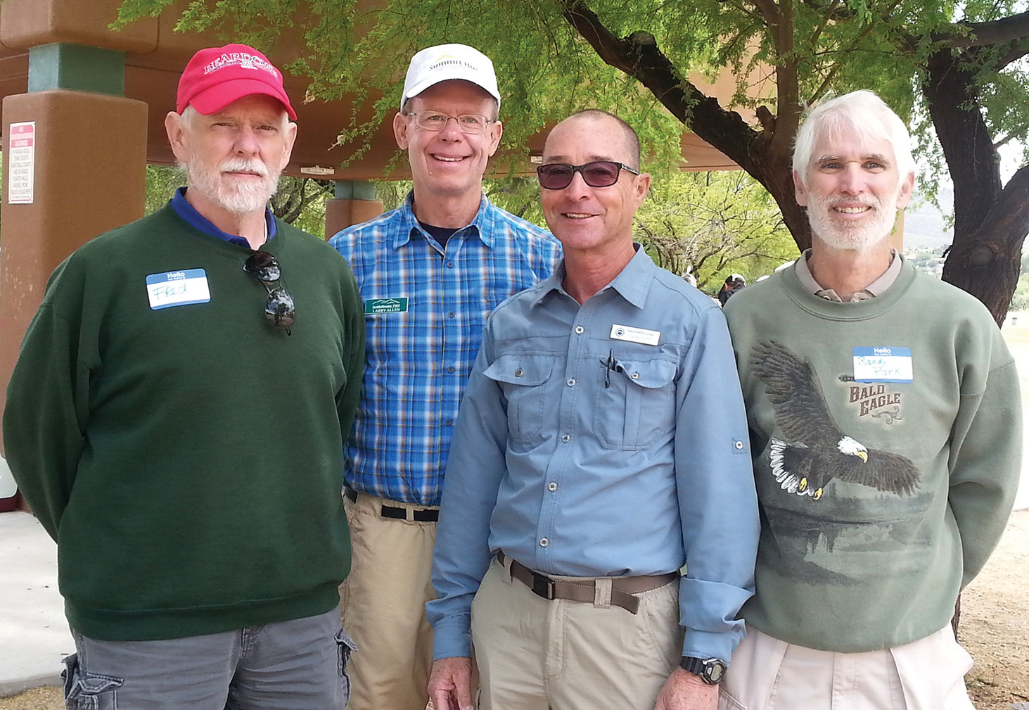 Outgoing SaddleBrooke Hiking Club President Larry Allen, second from left, with three of the new 2015/16 club officers (from left): Fred Norris treasurer, Tim Butler associate chief hiking guide and Randy Park vice president.