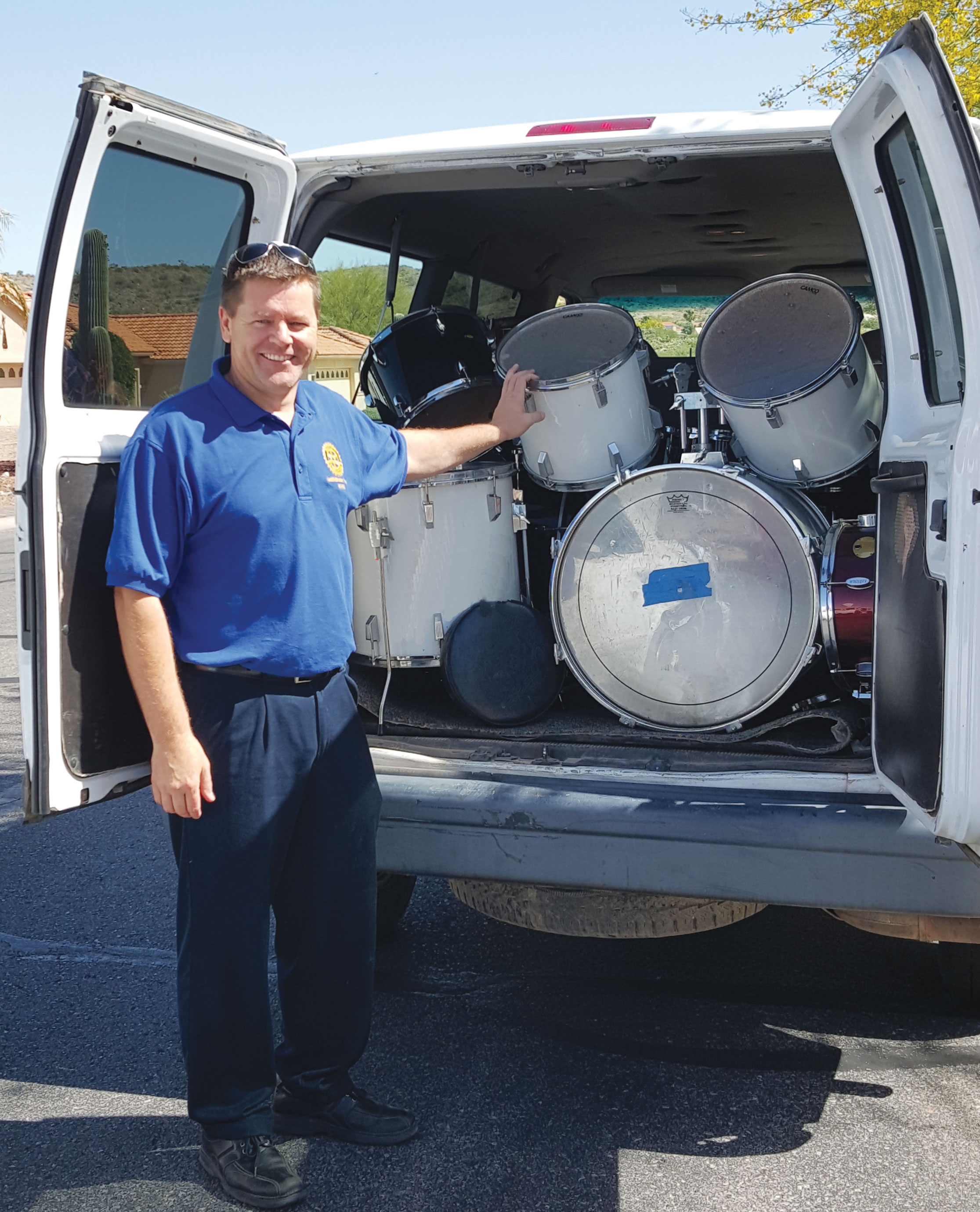 Mark Douglas, chair of Service Projects, gets ready to unload a drum set.