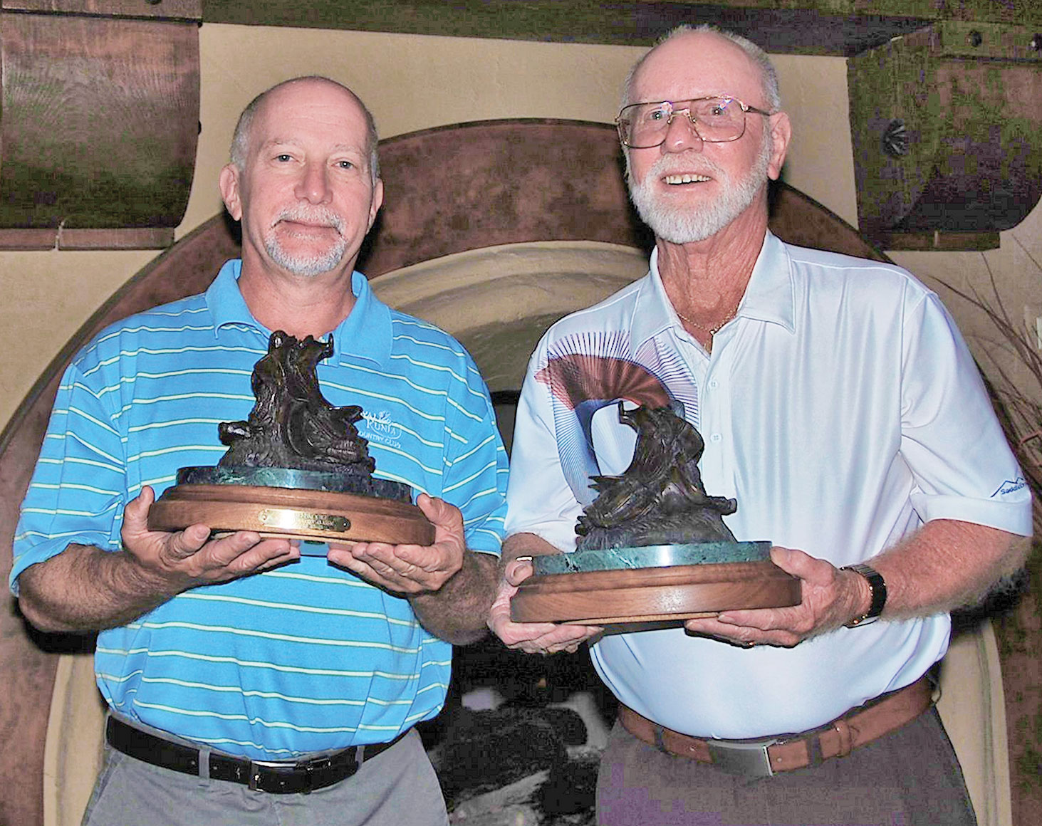 Jim Perko (left) and JR Salladay with their coveted RoadRunner Classic Saddle trophies