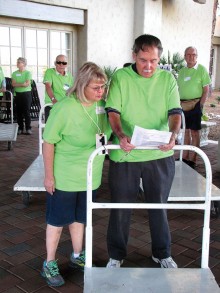 Volunteers prepare to assist exhibitors with set-up activities.