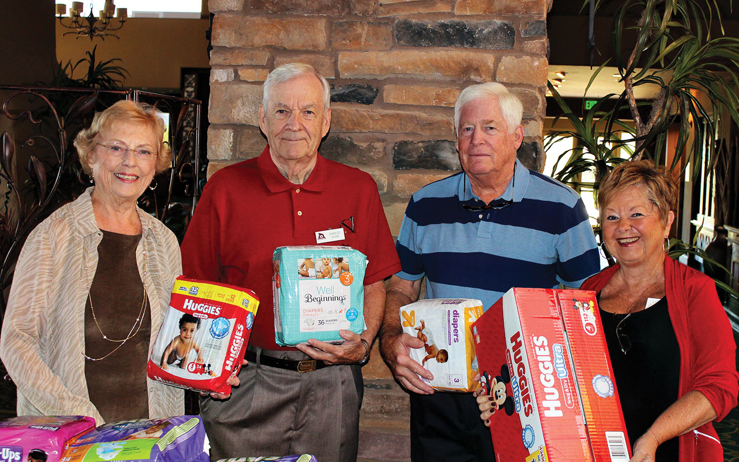 Shown with packages of diapers are Wanda Hutchison, Charles Dunn, Steve Carnahan and Sharon Sneen; photo by Clayton Thomas.