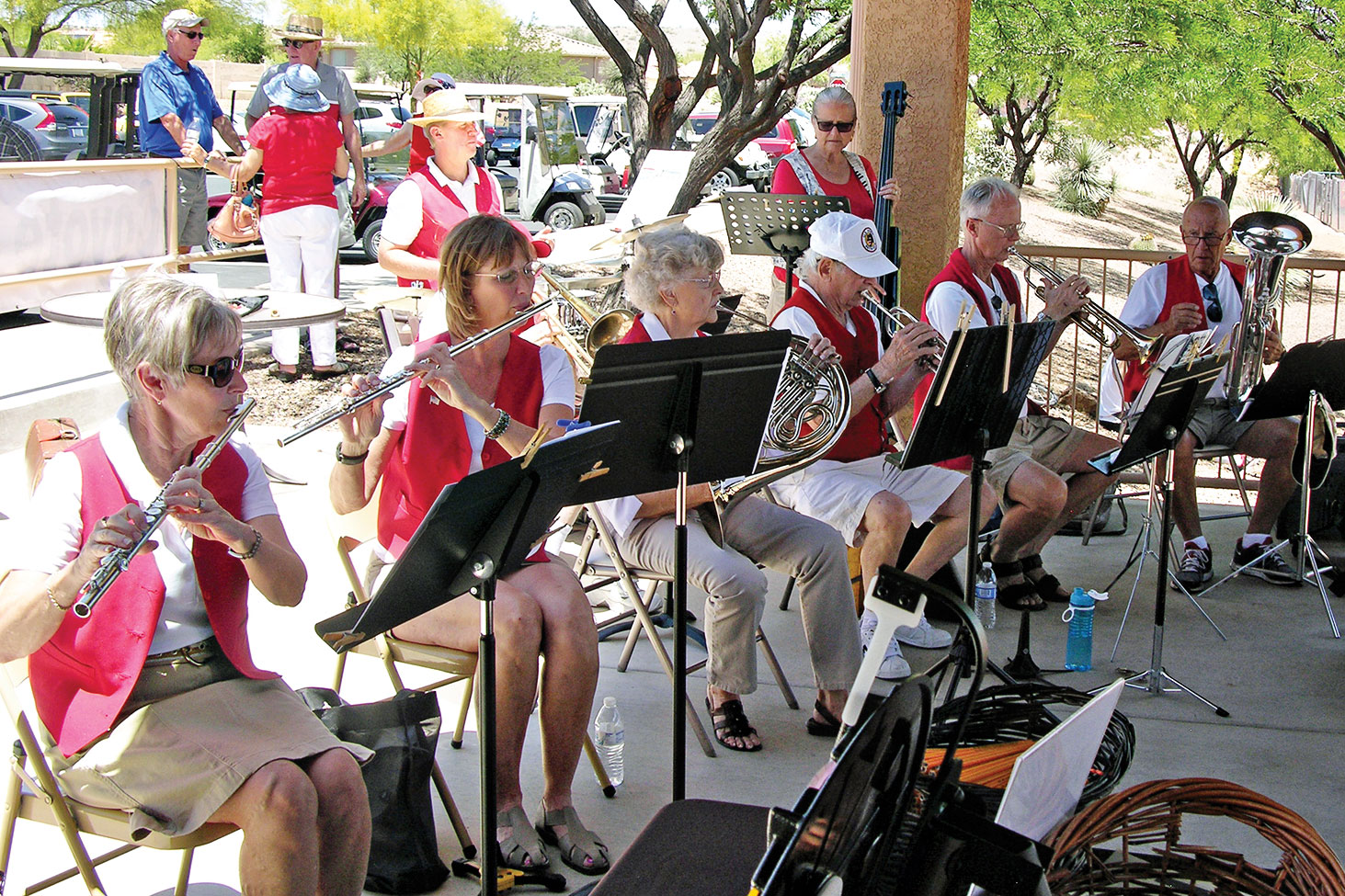 Members of SaddleBrooke Wind and Strings entertained the crowd between games; photo by Pat Tiefenbach.