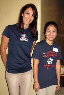 University of Arizona audiology students are on hand to help fairgoers sign up for free hearing tests.