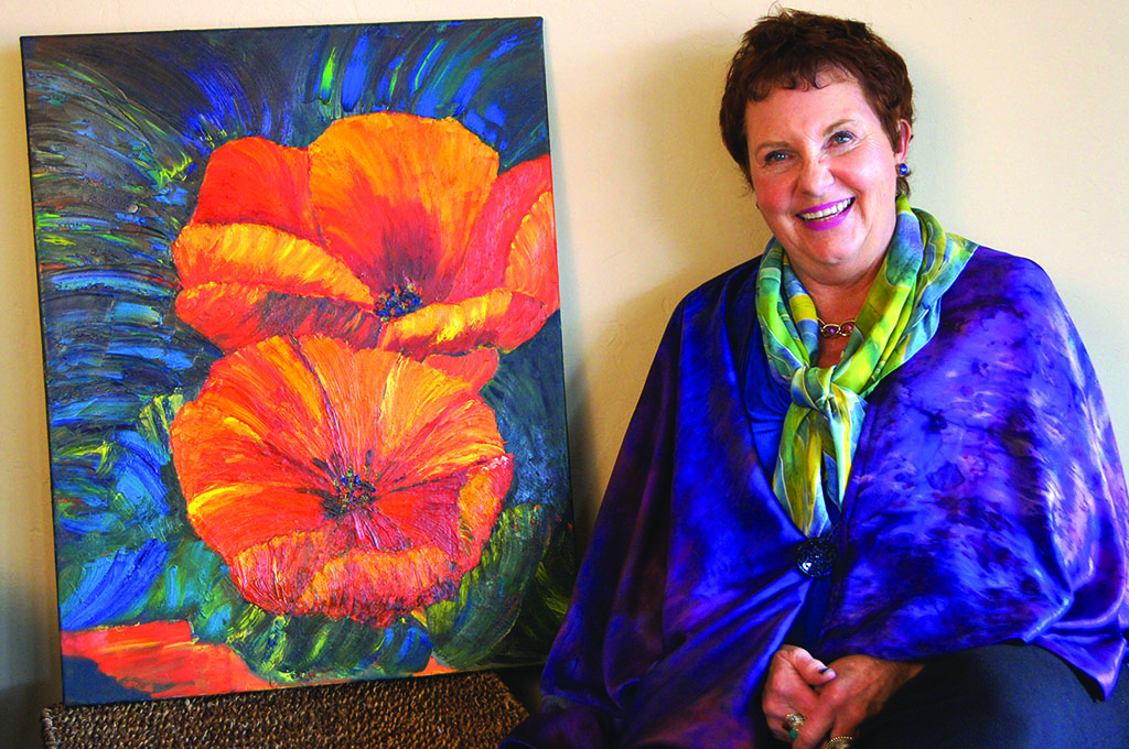 Kathy Borchert’s painting, Wild Poppies, textiles blouse and scarf. Photo by J. Cohen