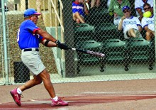 Local fans watch Q at bat.