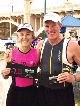 Teresa and Charlie Woodhouse make the podium at Ironman 70.3 Arizona. Teresa’s award appears larger than Charlie’s because it is. She won first place and he had to settle for third place; something he’s become accustomed to by now.