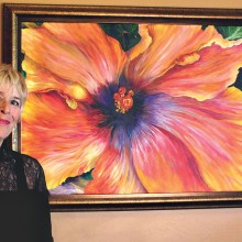 Jacqueline Cohen with her painting “Hibiscus.” Photo by D. Weinenger.