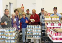 Pictured are (from left) Ron Aldrich, Mary Aldrich, IMPACT Executive Director Barbara McClure, Pat Cox, Gary Lippe, Billy Tyre, Walter Sundberg, JoAnn French and George Dorwart.