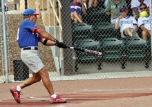 Local fans watch Q at bat.