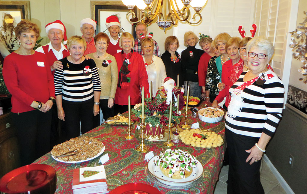 With several of their men helpers behind them, the Old Wise Ladies of Resurrection Church are ready for Cheer, Cheese and Chatter.