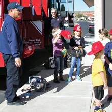 It’s a hit when Golder Ranch Firefighters show the kids how a real fire truck works; photo by Jim Smith.