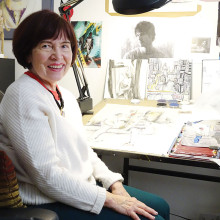 Marilynn Davis pauses in her studio surrounded by tools and partially created works.