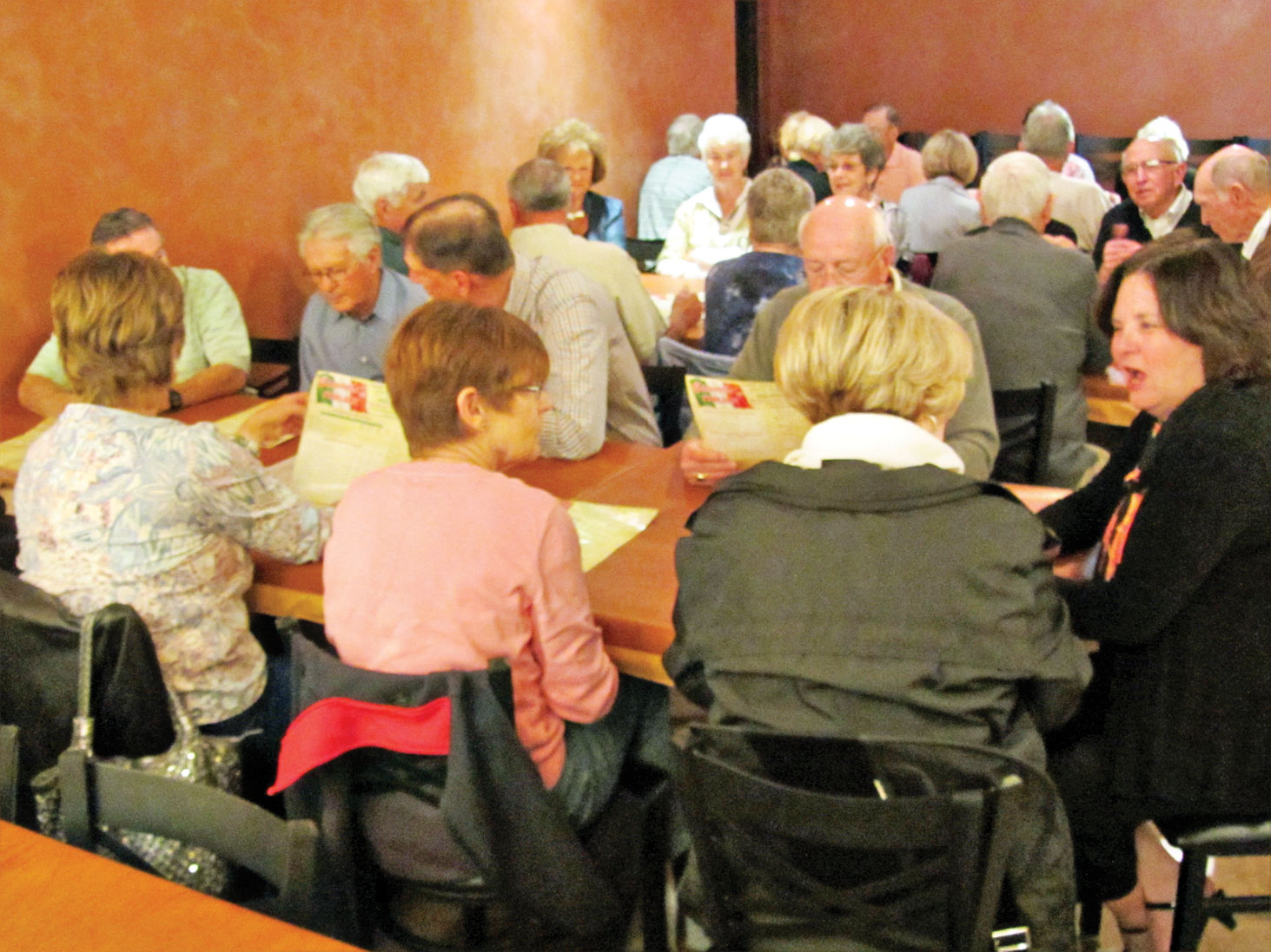Three tables of diners at Bianchi’s Italian Restaurant; photo by Ron Talbot